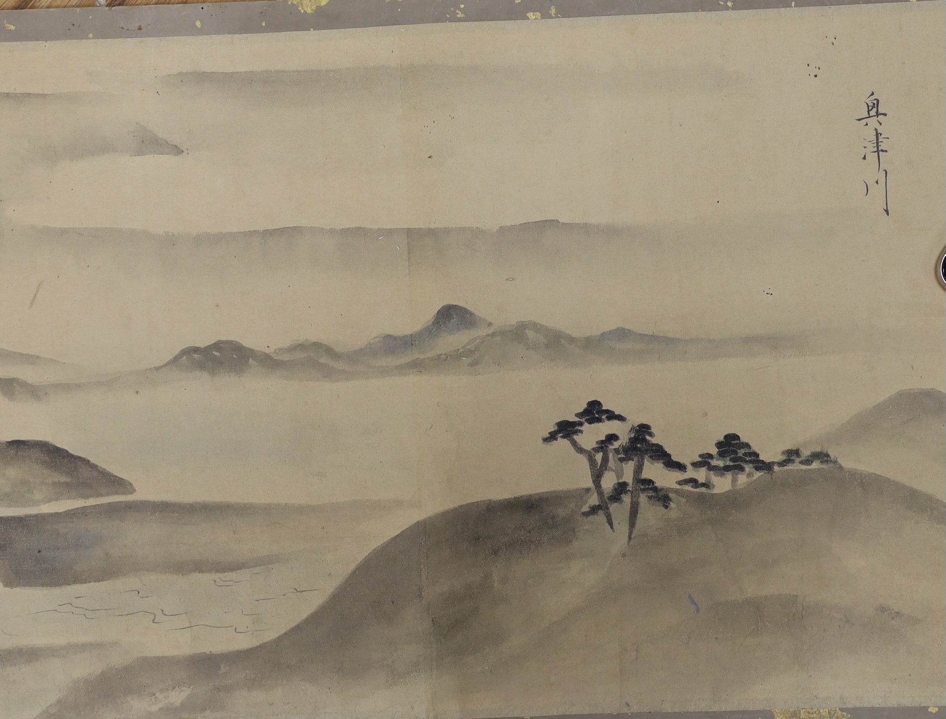 A Japanese landscape painting on paper hand scroll, Edo period, titled views, now in two parts, incomplete, image 27cm high x approximately 470cm wide